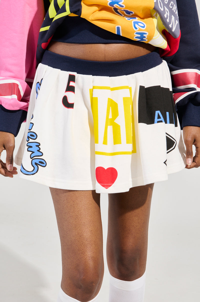WE ARE INFINITE PLEATED MINI SKIRT