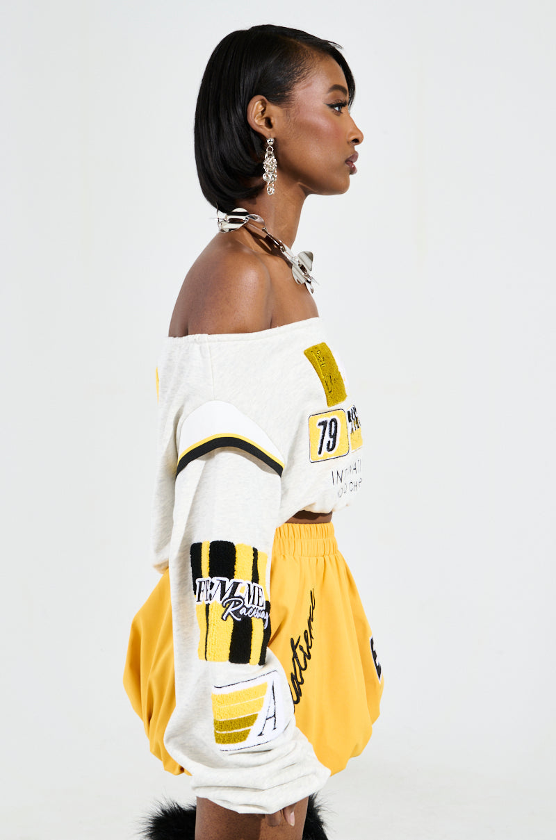 RACING THROUGH OFF THE SHOULDER SWEATSHIRT